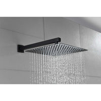 Eclipse Series matte black rainfall shower head spraying a wide, even stream of water