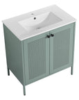 Angled view of 30" mint green 30 inch bathroom vanity with legs featuring ceramic sink and perforated double doors | Ace Decor