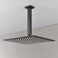 Modern bathroom view showing the Lorton 12" black rain shower head mounted overhead with a wide spray area.