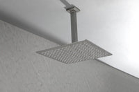 Side-angle bathroom scene with the Lorton brushed nickel 12" rain shower head mounted from above.