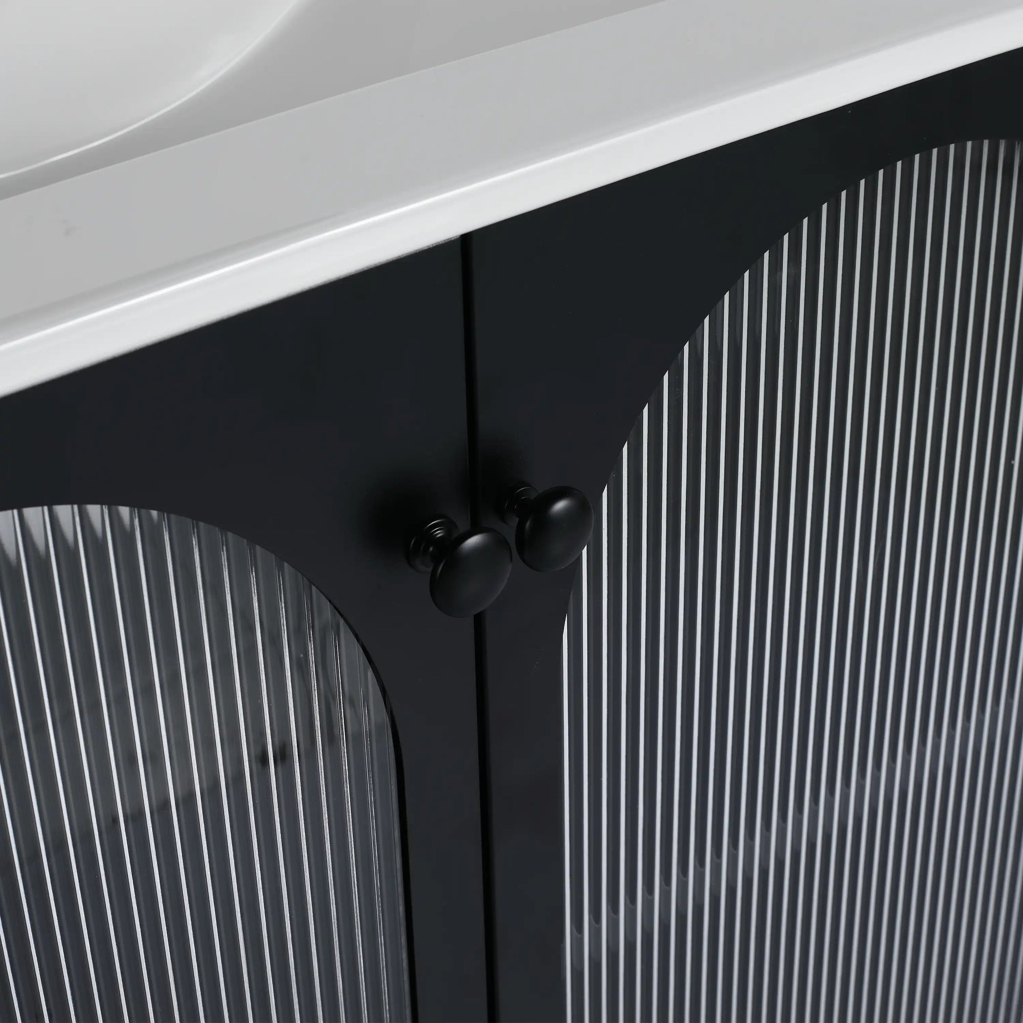 Detail of ribbed acrylic cabinet doors with black knobs on 30" freestanding makeup vanity | Ace Decor