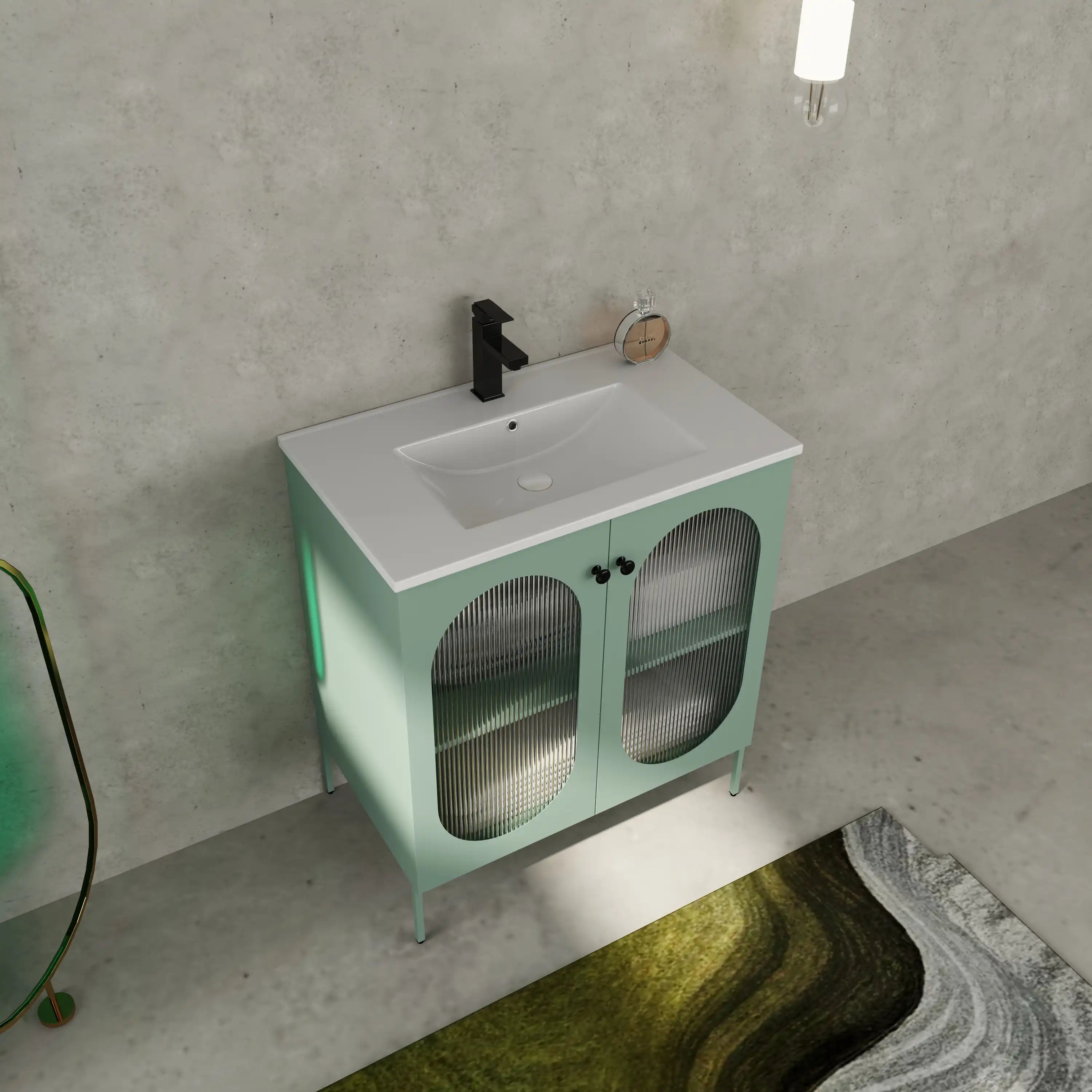 Angled bathroom view of 30" mint green freestanding bathroom vanity with black faucet in modern interior.