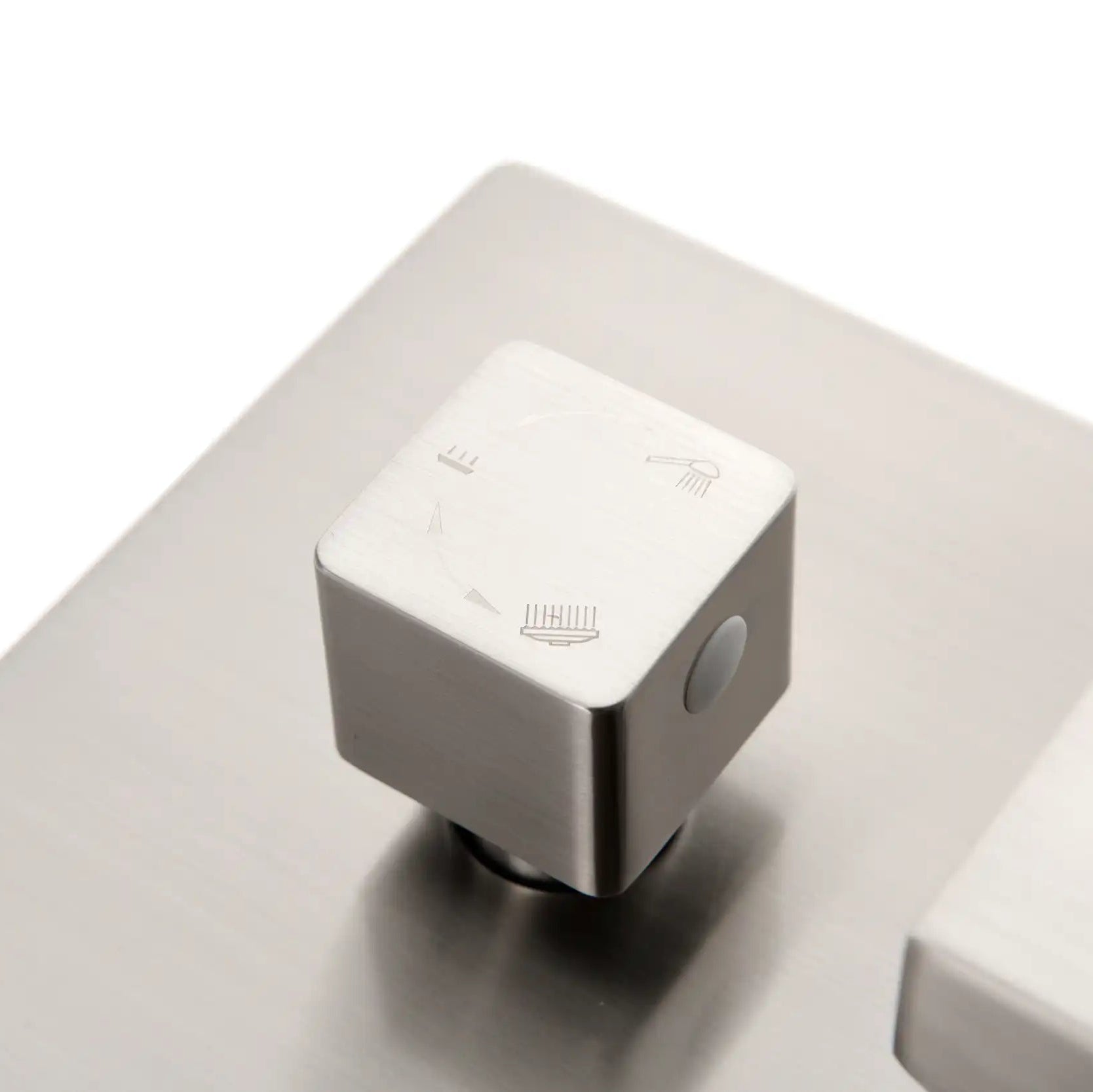 Three-way shower diverter knob with engraved function icons for smooth switching.
