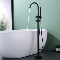 Full view of Freestanding Black Tub Faucet with Handheld Shower beside modern bathtub, sleek matte black finish and minimalist design.
