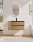 36" wall mounted bathroom vanity with oak finish and integrated sink in modern bathroom | Ace Decor
