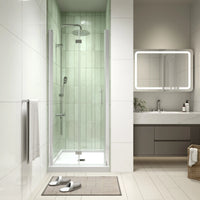 AeroFold Series 30 x 72 chrome semi-frameless bi-fold shower door installed in a modern alcove bathroom.