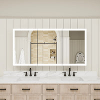 Three-door lighted medicine cabinet installed in double sink bathroom