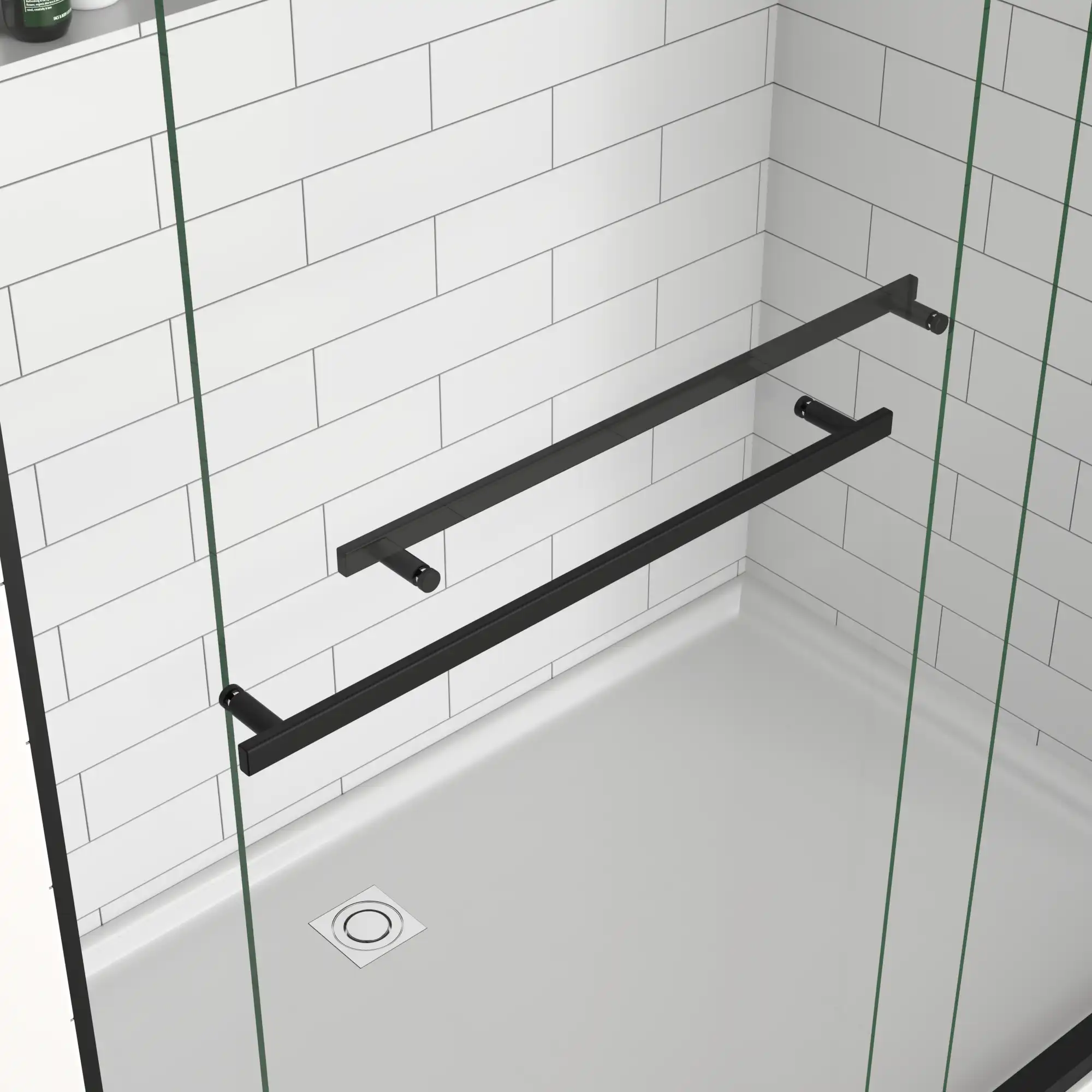 Stainless steel handle detail of matte black 60 x 70 sliding shower door.