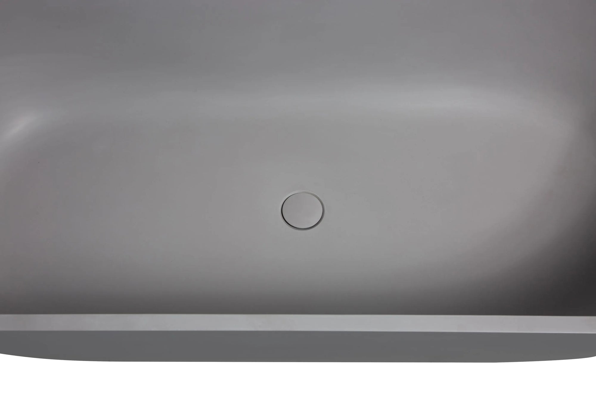 Seamlessly integrated center drain on the Nectar Series 63" matte gray bathtub.