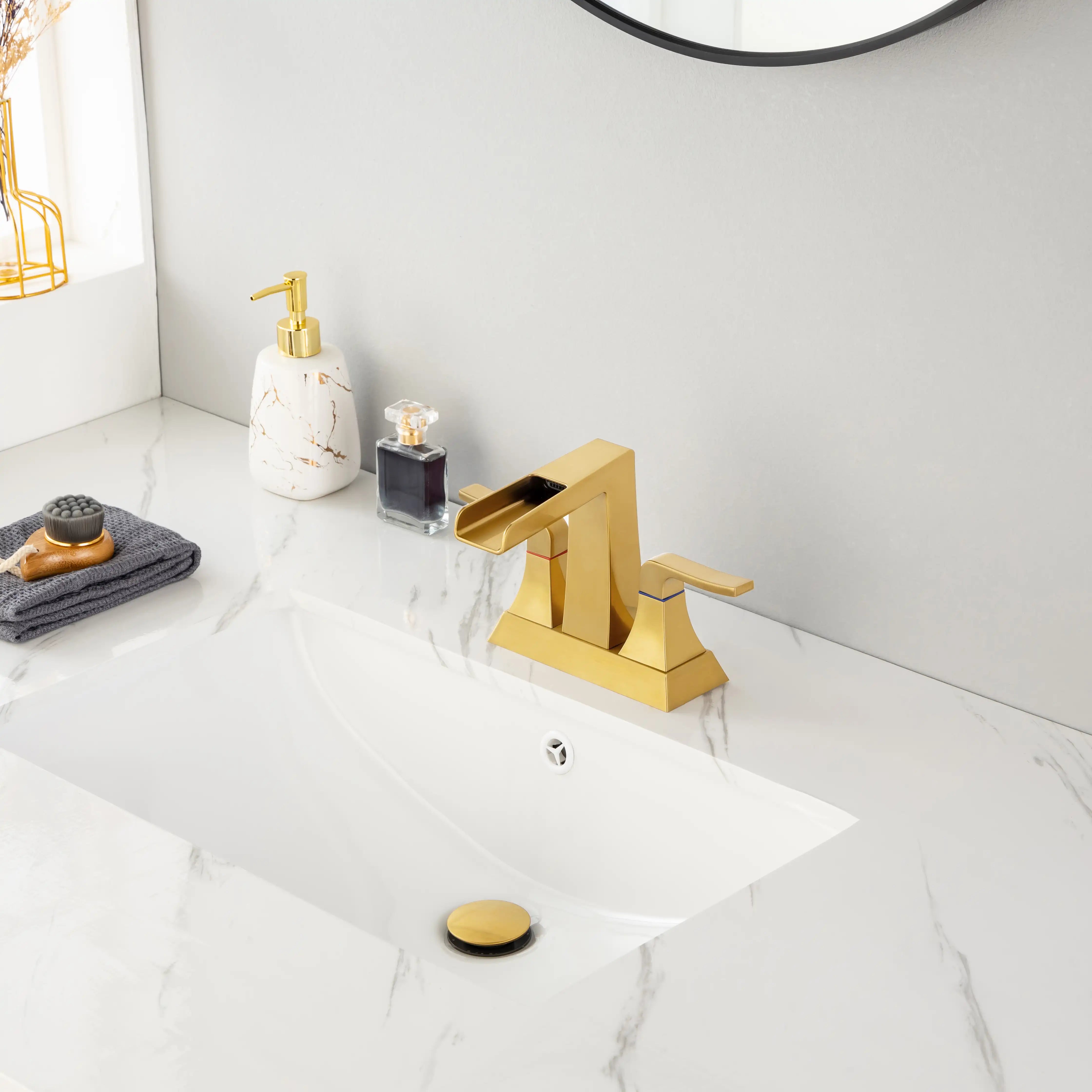Aurora Series brushed gold widespread bathroom faucet installed on sink, contemporary bathroom décor