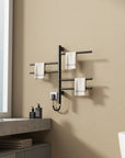 16 x 27 black heated towel rack installed beside a bathroom sink, holding white towels | Ace Decor