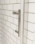 Chrome shower door handle on clear glass with white subway tile background | Ace Decor