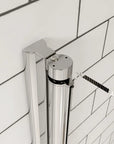 Chrome pivot hinge detail on clear glass shower door with subway tile wall | Ace Decor