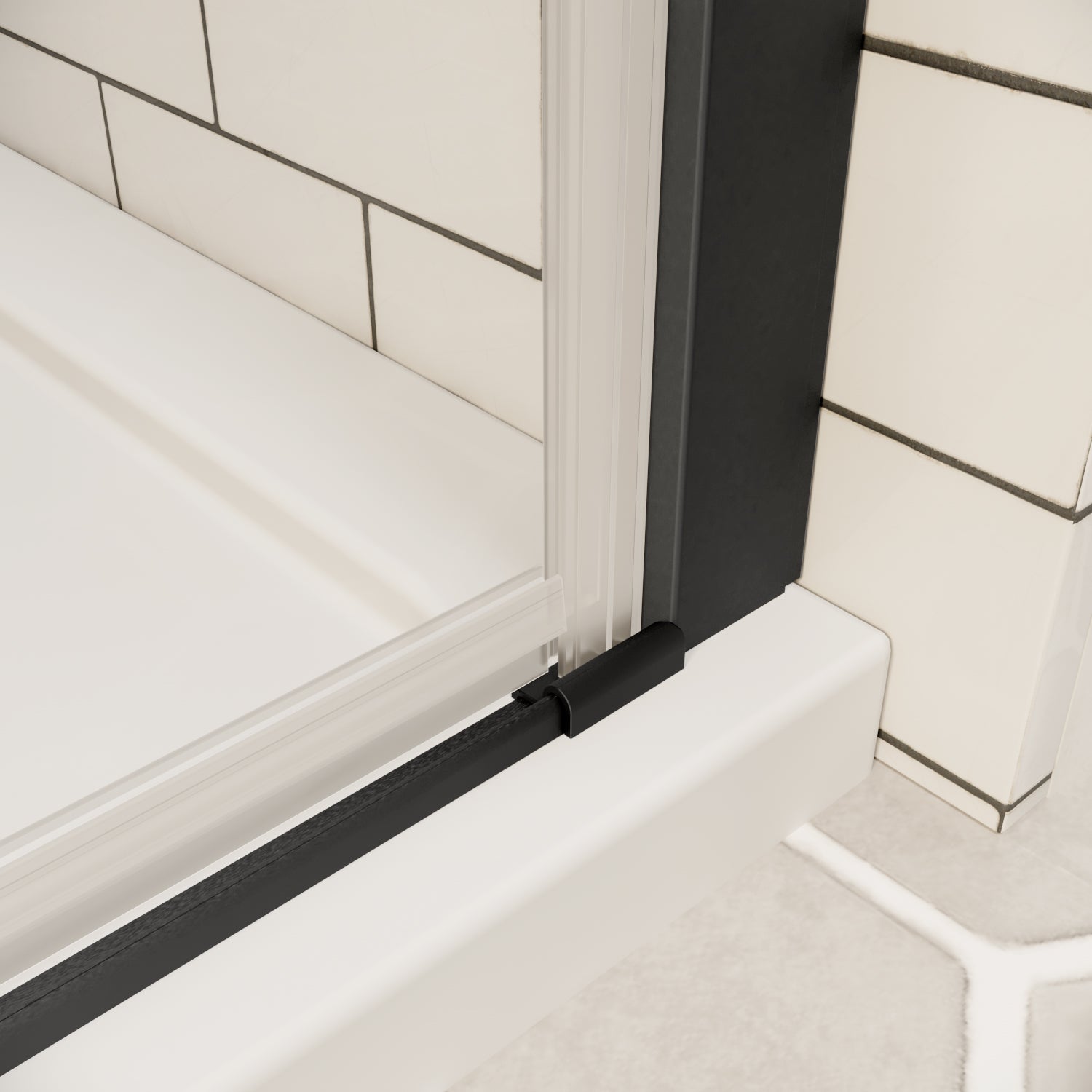 Bottom track and seal detail of matte black framed shower door on white shower base | Ace Decor