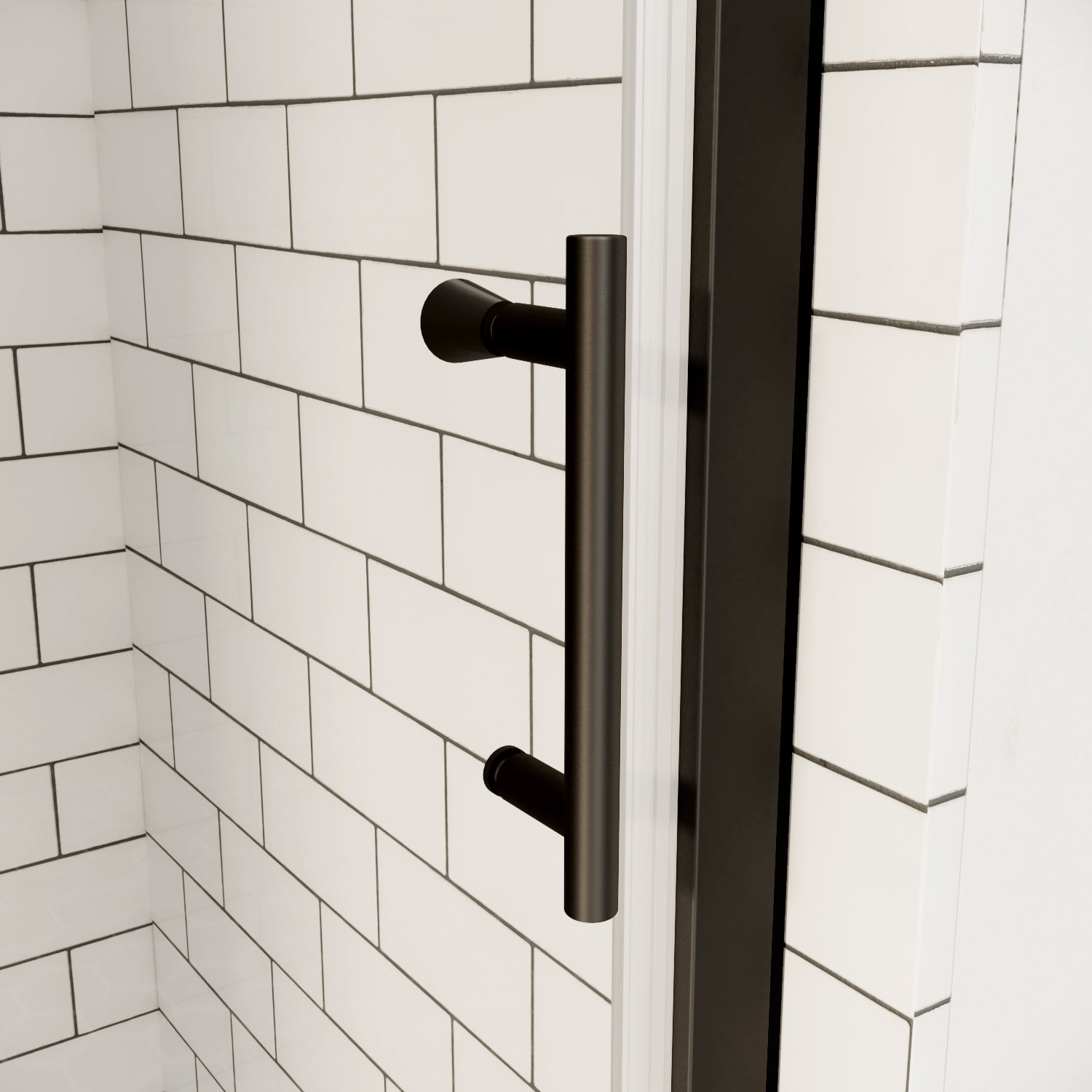 Matte black shower door handle on clear glass with white subway tile background | Ace Decor