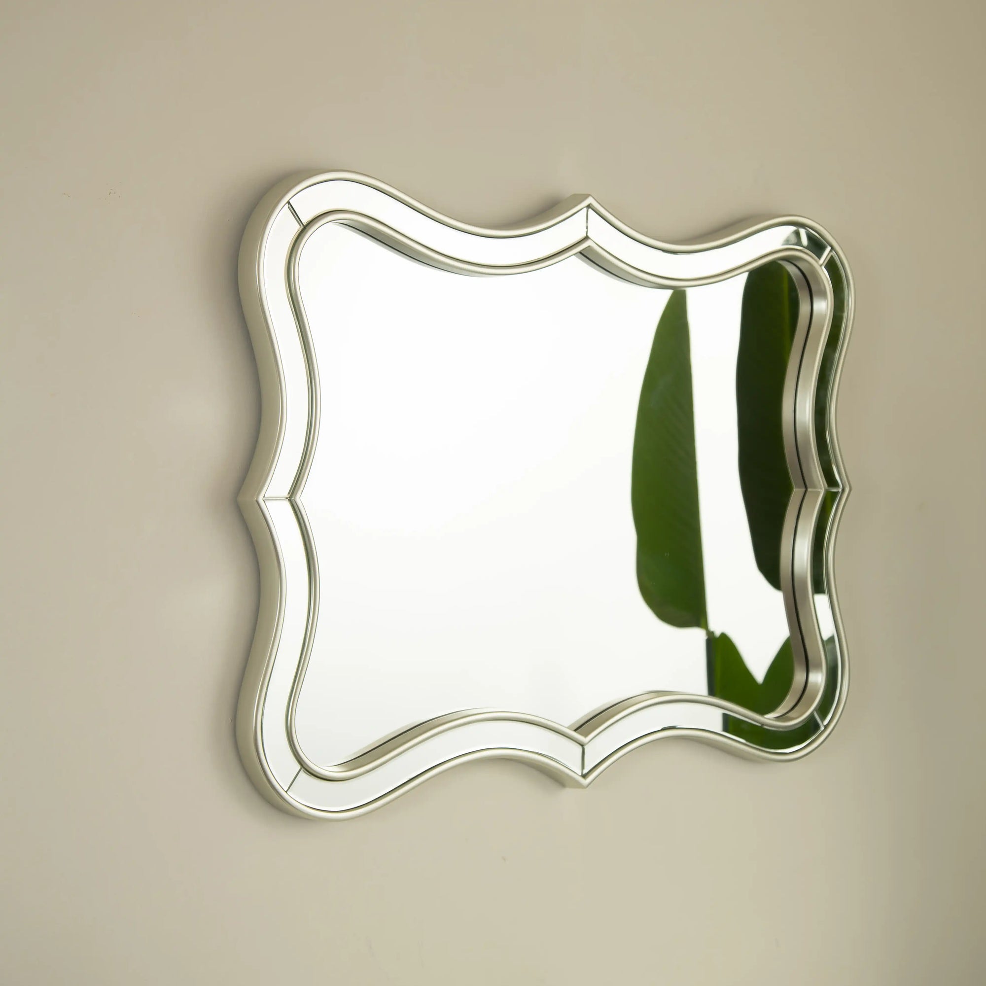 Side-angle view showing the 32&quot; x 24&quot; rectangular modern mirror with curved beveled PU frame | Ace Decor