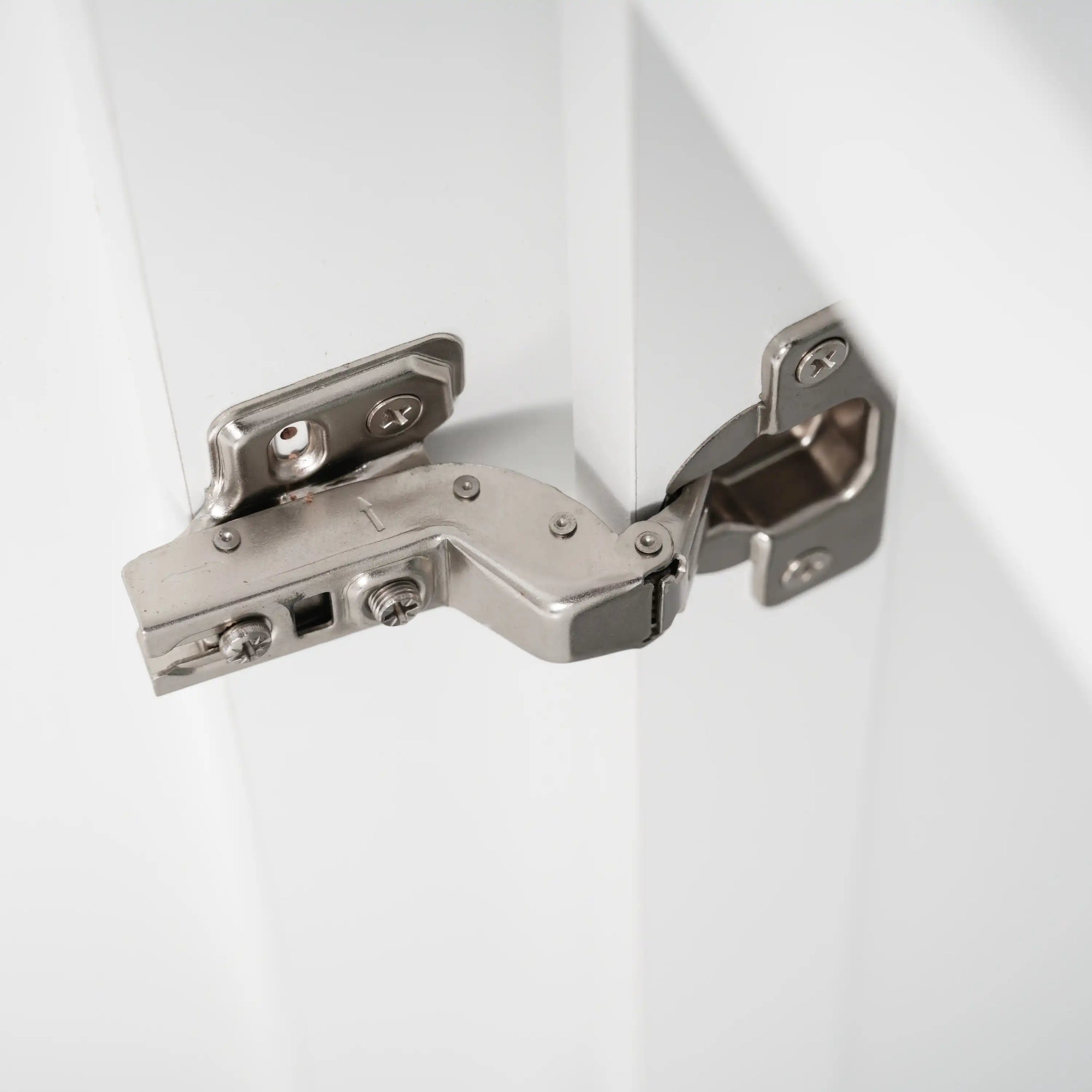 Soft close hinge detail on a freestanding bathroom vanity, ensuring quiet, safe, and durable cabinet door operation | Ace Decor