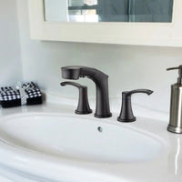 Harbor Series matte black bathroom faucet in modern vanity setting with dual handles