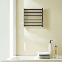22 x 20 black heating towel racks wall mounted above bathroom sink in modern home interior | Ace Decor