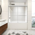 Montra chrome framed double sliding bathtub shower door installed on an alcove tub in a modern bathroom.