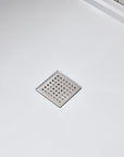 Anti-slip shower base with stainless steel square drain cover for smooth water drainage.