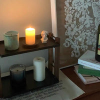 Walnut 8 inch single-layer vanity tray organizing candles and bathroom essentials beside bathtub.