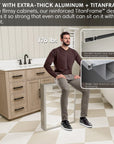 Man sitting on reinforced medicine cabinet frame supporting 176 lbs.