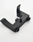 Matte black solid copper wall-mounted bathtub faucet body detail.
