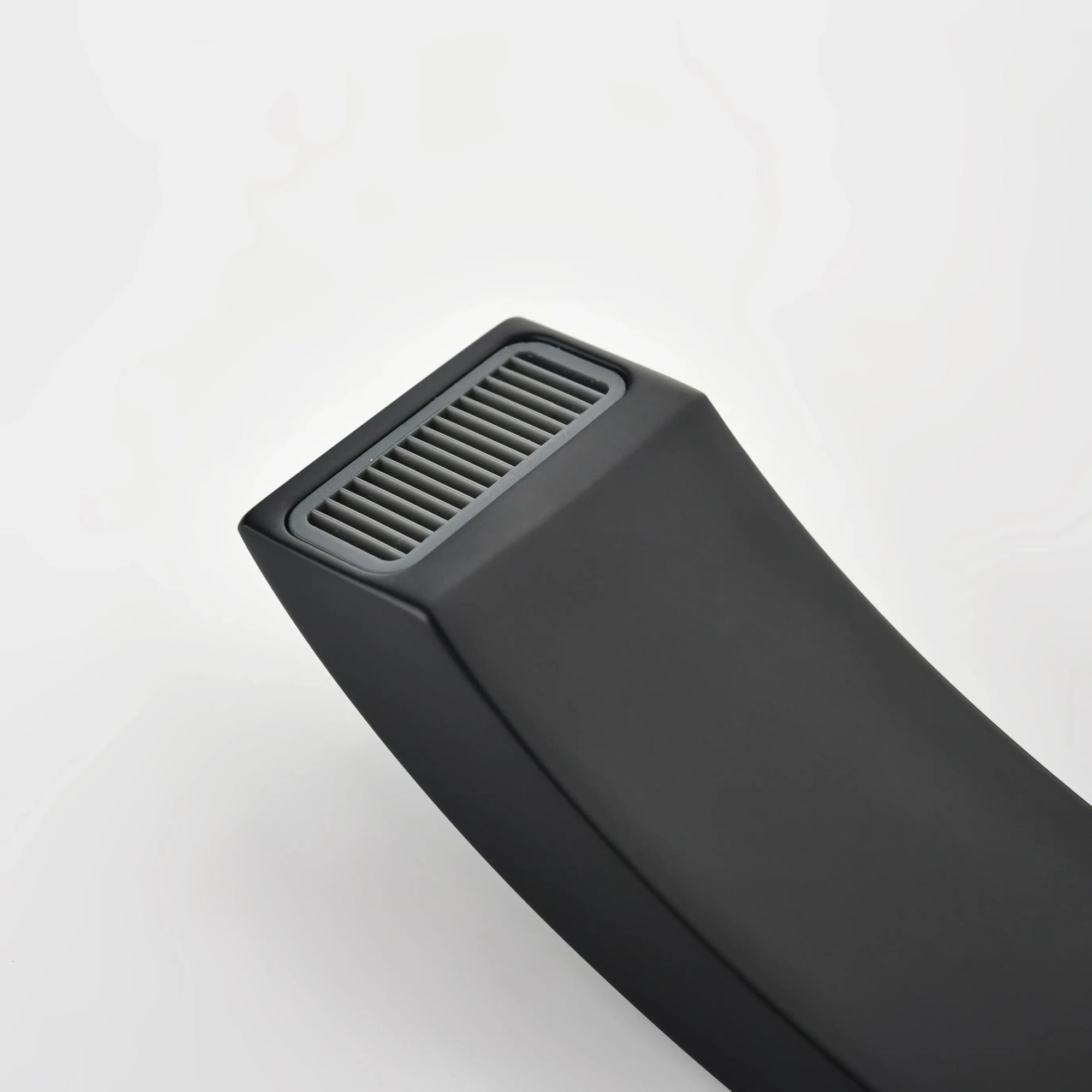 Close-up of the matte black tub spout with streamlined modern design.