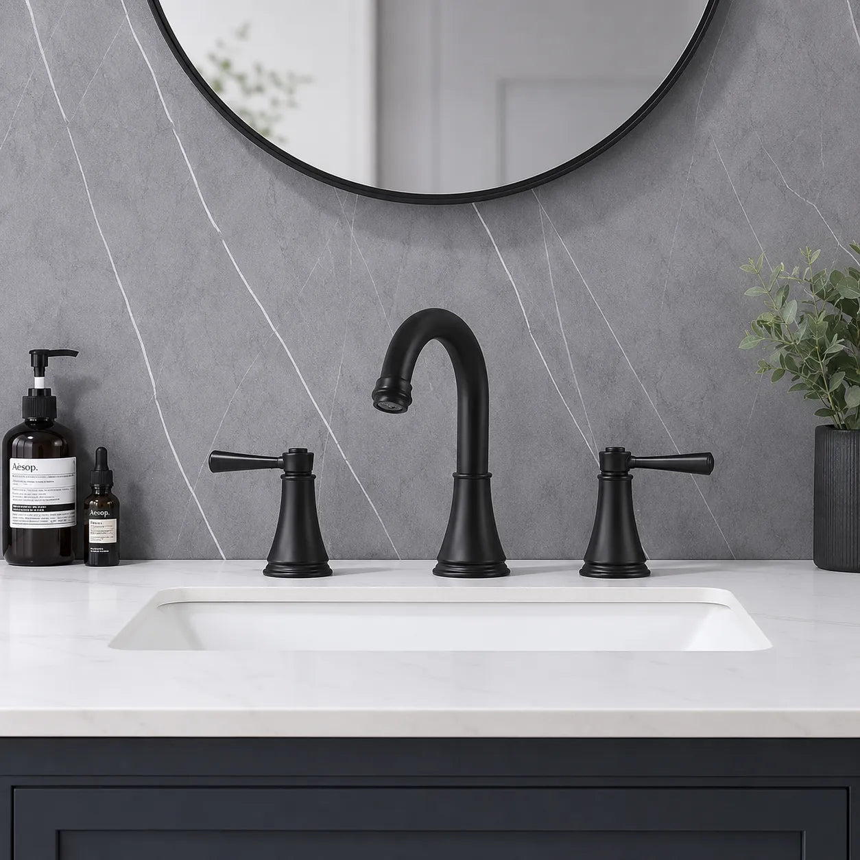 VALMIRA matte black widespread vanity faucet installed on a bathroom vanity.