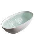 Angled top view of the Abyss Series 59-inch curved matte white stone resin freestanding soaking tub filled with water.