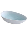 Abyss Series 59-inch egg-shaped resin tub on white background, filled with tranquil water.