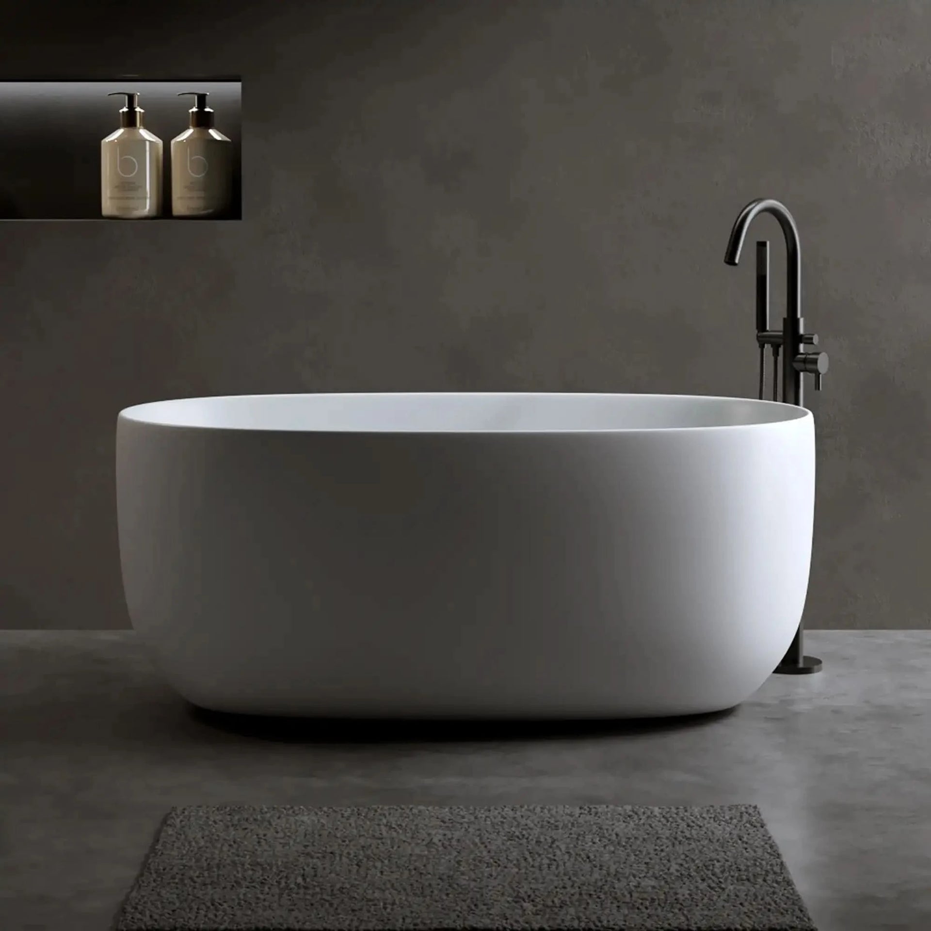 A modern bathroom featuring a sleek freestanding stone resin bathtub with a matte finish, set against a dark minimalist backdrop.