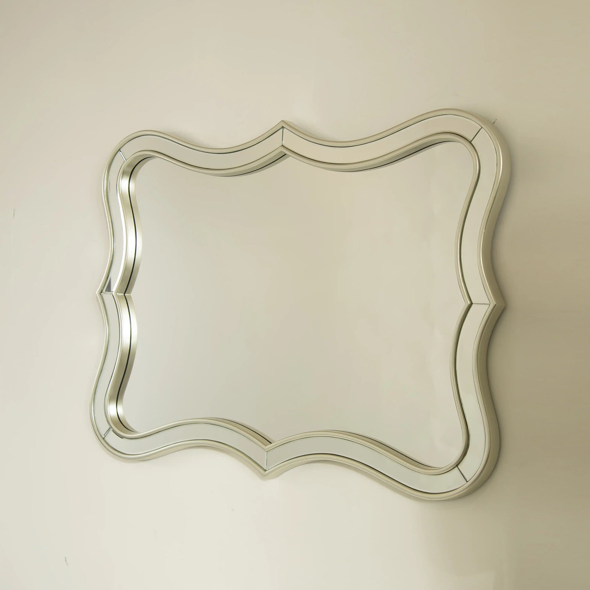 Front angled look at the 32&quot; x 24&quot; rectangular modern mirror with decorative curved edges | Ace Decor