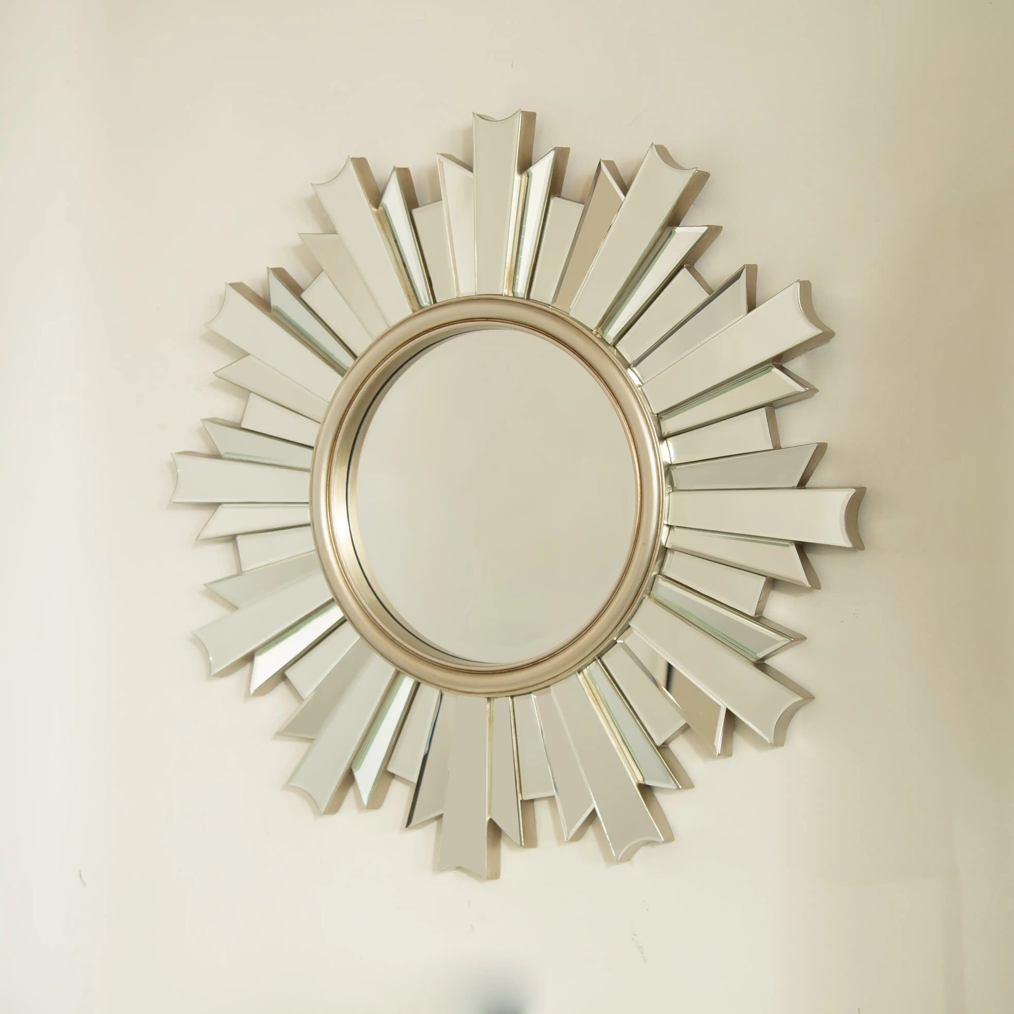 26 inch sunburst bathroom mirror mounted on wall with sculpted mirrored rays | Ace Decor