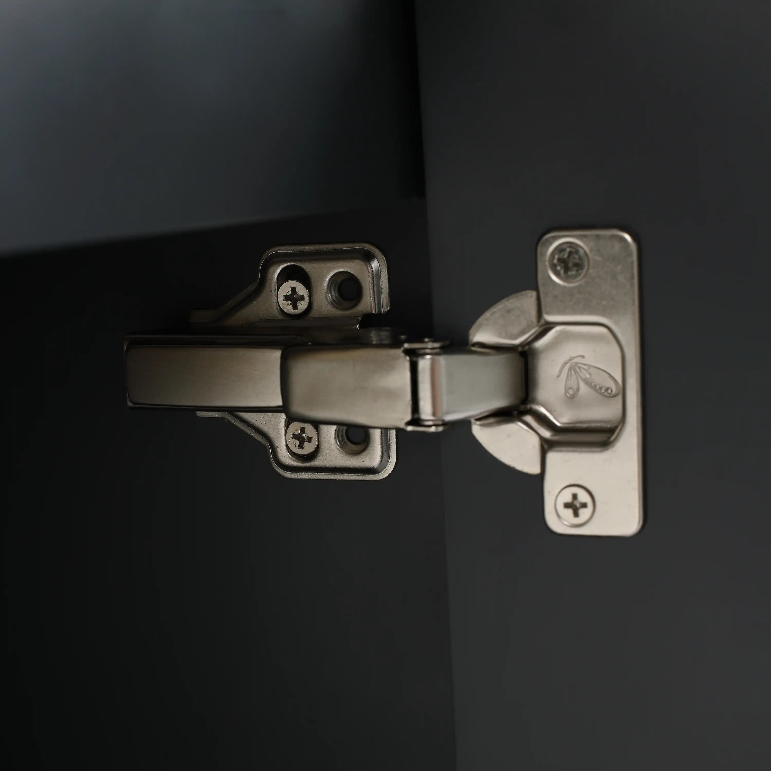 Close-up of soft-close hinge inside modern bathroom floating vanity cabinet for smooth, quiet operation.
