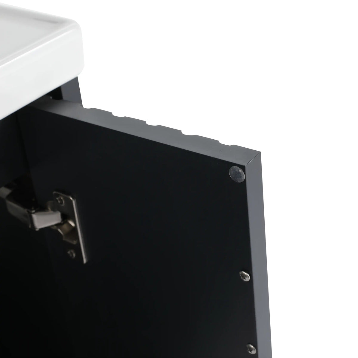 Interior detail of modern bathroom floating vanity showing soft-close hinge and clean edge finish.