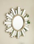 26 inch PU and glass sunburst mirror for bathroom decor shown at an angle | Ace Decor